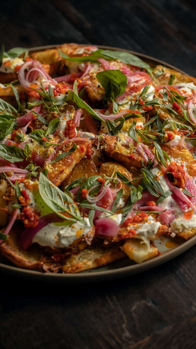 Crispy Smashed Potatoes & Halloumi with Sour Cream, Italian Chili & Fresh Herbs | Gather & Feast